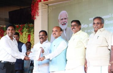 Rojgar Mela Hon'ble Minister giving orders to beneficiary