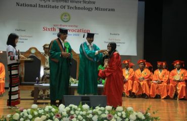 Governor presenting degree to the student