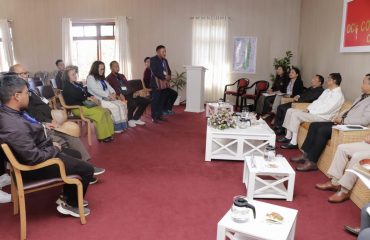 Interacts with officials