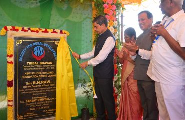 Thiru. R.N. Ravi, Hon'ble Governor of Tamil Nadu, laid down foundation stone of new school building by Raj Bhavan, Tamil Nadu initiative with the support of Corporate Social Responsibility of Armoured Vehicles Nigam Limited, Avadi, Chennai and also distributed welfare kits to 1000 parents of SFRD Tribal School Students at the event held at SFRD Tribal School, Guniganthur, Jawadhu Hills, Thiruvannamalai District - 11.11.2025.