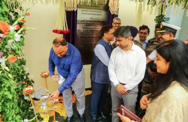 Shri K J S Chauhan, Principal Director, Defence Estates, Southern Command lightening the lamp