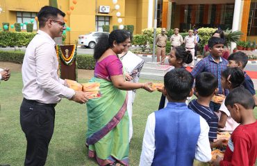 Sweets being distributed among the children on the occasion of 77th Independence Day