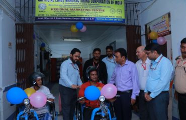 Sri Rajesh Aggarwal, IAS, Secretary, Department of Empowerment of Persons with Disabilities (Divyangjan), Ministry of Social Justice and Empowerment, Govt. of India providing motorized wheelchair to Divyangjan at ALIMCO Regional Marketing Centre at NILD.