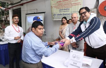 Sri Sougato Banerjee, Dy. Director (Admn.), NILD awarding prize to the Quiz Competition winner