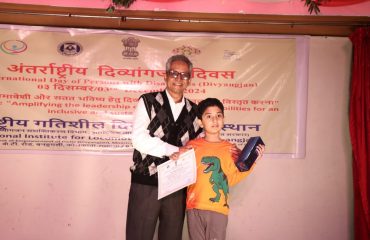 Dr. Ameed Equebal, Asstt. Director(Training) awarding prize to the Divyang Child during the Cultural program