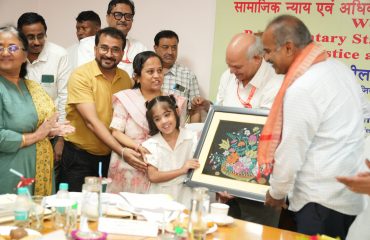 Sri P. C. Mohan Chairman, Parliamentary Standing Committee on Social Justice and Empowerment receiving memento by Divyang child
