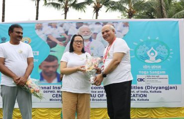 Diector, NILD felicitating to Ms. Jane Namchu, Additional Director General, Eastern Region, PIB & CBC, Union Ministry of Information and Broadcasing, GOI