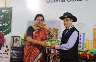 Ms. Mamata Khamari, DDG & ASIO presenting sapling to Shri Anupam Bose as a symbol of life and development.