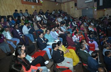 Audience enjoying the cultural and artistic presentations at the event.