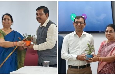 Senior officers from NIC Odisha presenting a sapling to esteemed guests.