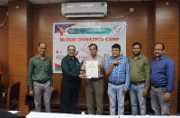 Dr. Debi Prasad Rath, representing the Red Cross, formally handed over certificates for 57 units of blood donated to the National Informatics Centre.