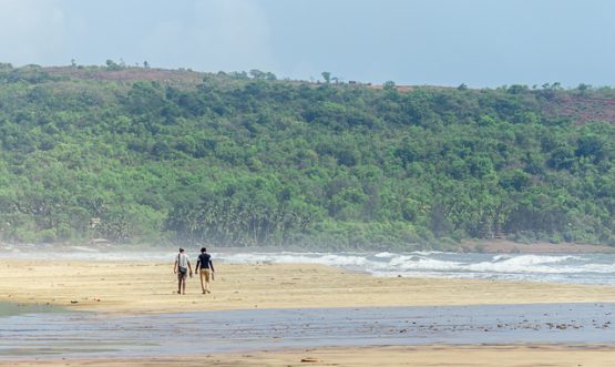 Two,People,Walking,On,Guhagar,Beach,In,Maharashtra