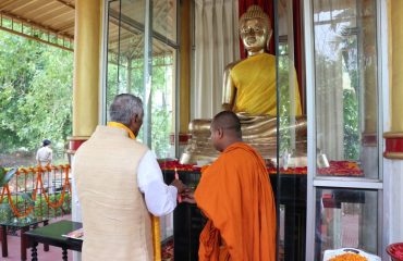 His excellency offering prayers to Lord Buddha