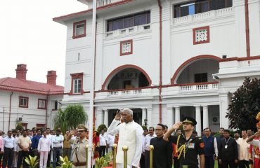 His Excellency saluting the National Flag