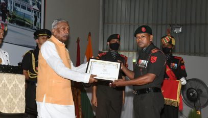 His Excellency felicitating the Soldier.