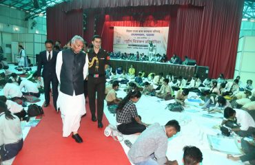 His Excellency observing the children at the painting competition.