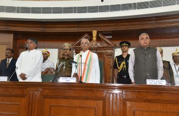 His Excellency paying respect to the national anthem.