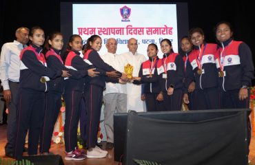 His Excellency felicitating women athletes.