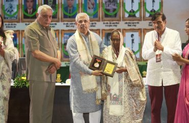 His Excellency presenting memento to the wifes of martyrs.