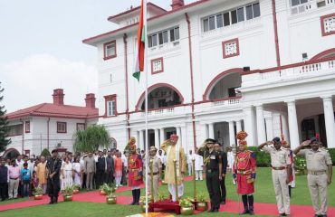 His Excellency saluting the National Flag