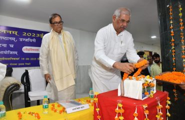 His Excellency bowing to the Vedas.