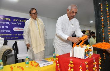 His Excellency bowing to the Vedas.
