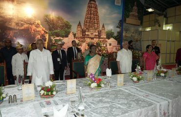 Honorable dignitaries standing in attention for the National Anthem.
