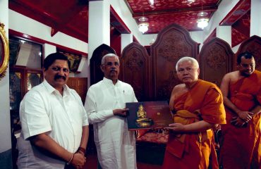 Honorable Governor being welcomed by Buddhist Monks.