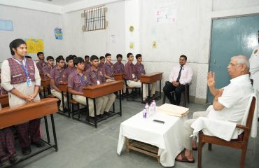 Honorable Governor interacting with students.