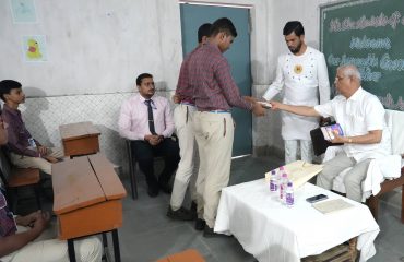 Honorable Governor distributed books among students.