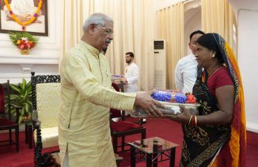 Honorable Governor distributing gifts among Raj Bhavan staffs.