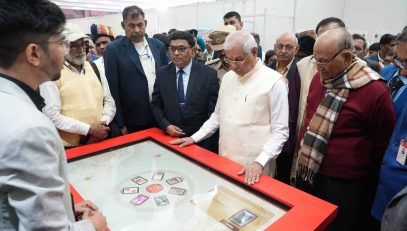 Honorable Governor observing different postage stamps at the exhibition.