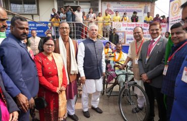 Honorable Governor distributing tricycles to divyanjans.