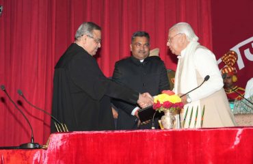 Honorable Chief Justice congratulating Honorable Governor after administering the oath.