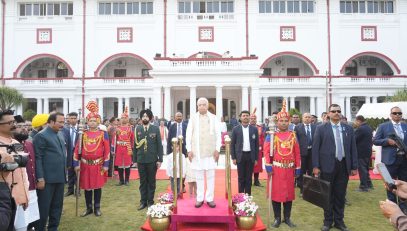 Honorable Governor in attention position for the National Anthem.