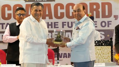 Hon'ble Governor felicitating T.C.A. Raghavan at the event.