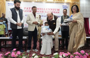 Hon'ble Governor distributing gifts to children.