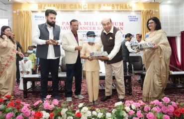 Hon'ble Governor distributing gifts to children.