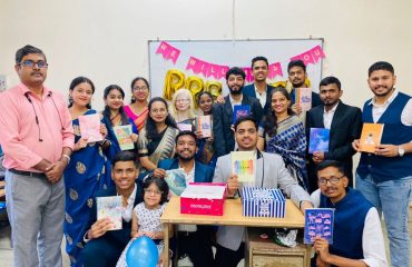 Class group photo of Free Coaching Scheme for PwDs (RRB-SSC Examination) students with Ms.Vidhi Shah, Rehabilitation Officer and Nodal Officer (Free Coaching Scheme) and Ms. Neha Patkar, Computer Instructor.