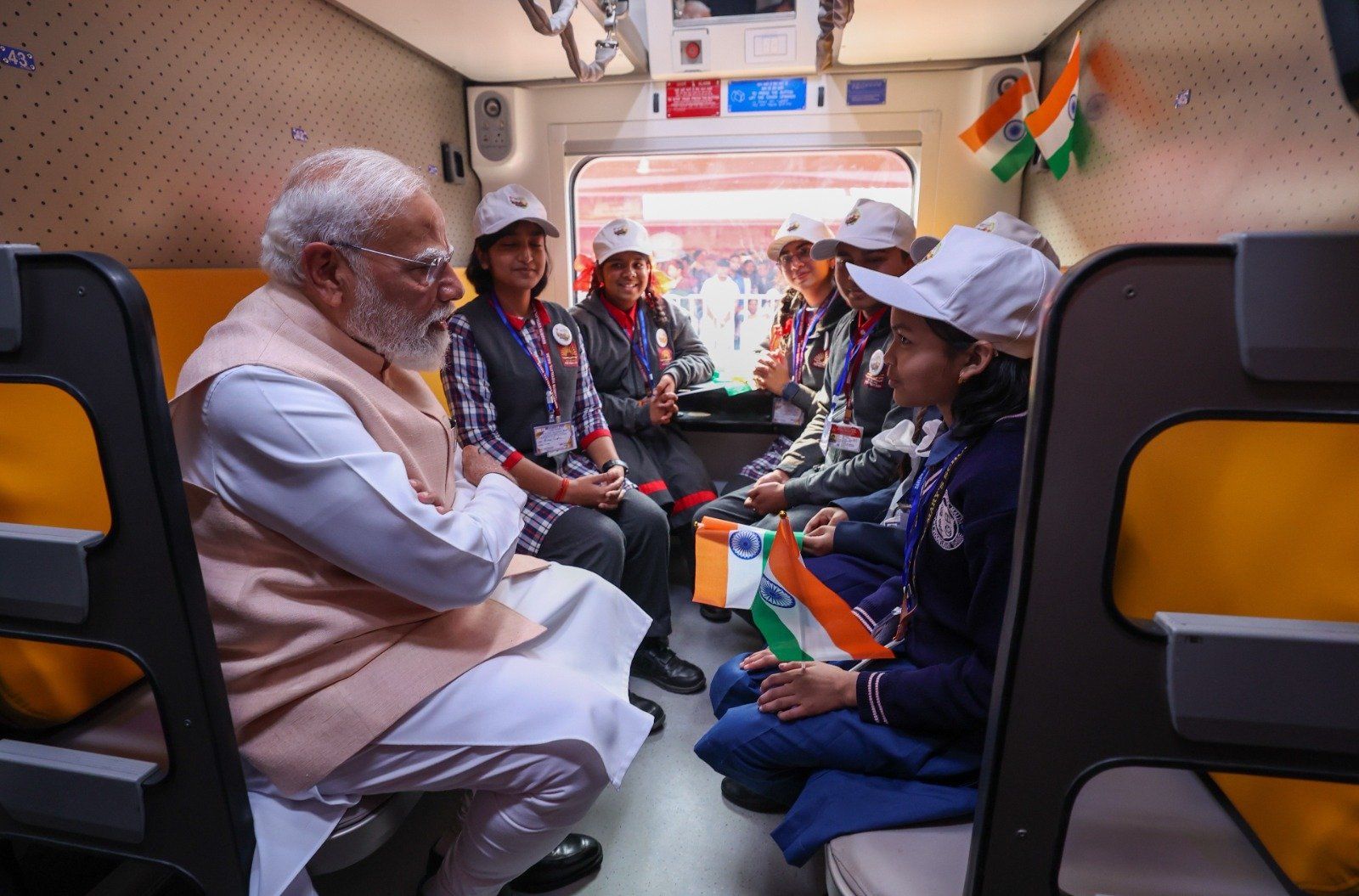 KV Students with Hon'ble Prime Minister Sh. Narendra Modi during the inaugural run of first Sleeper Vande Bharat Train.