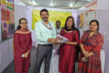 Director distributed brouchures to visitors of NIEPMD stall