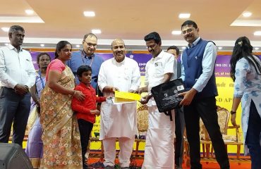 Distribution of TLM kit to one of the beneficiary by Honble Minister