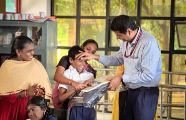 Distribution of Uniform, Books and Bag to Children with Multiple Disabilities by Director