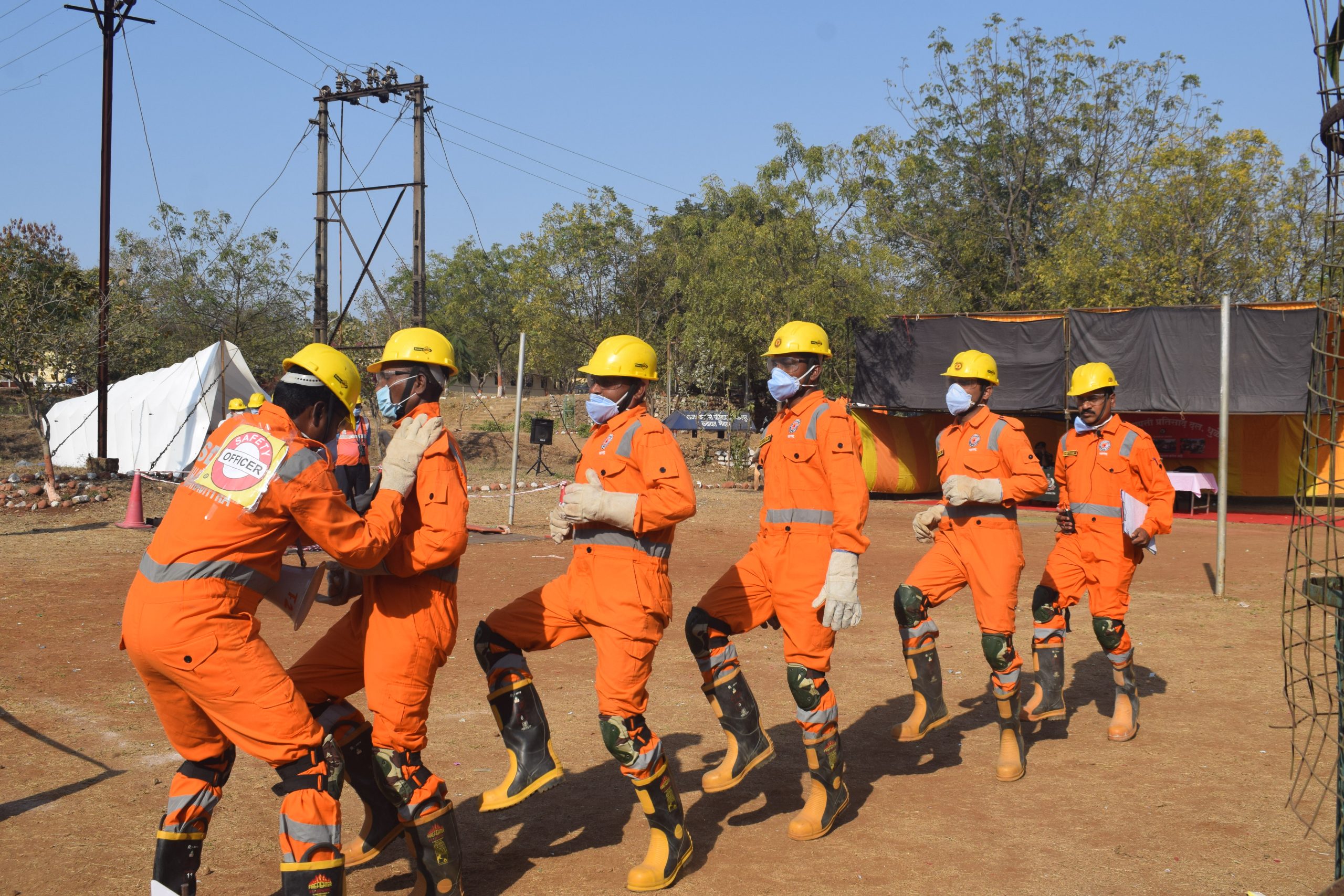 NDRF personnel march in full gear during the training routine