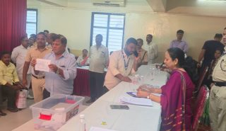Officials and staff from the Thane office of the Mumbai Metropolitan Region Slum Rehabilitation Authority present at the flat allotment lottery.