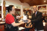 Dr.L.P.Sharma, State Informatics Officer Receiving a gift from PIB ADG , Gangtok