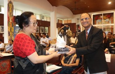 Dr.L.P.Sharma, State Informatics Officer Receiving a gift from PIB ADG , Gangtok
