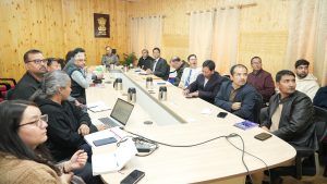 Chief Secretary Dr. Pawan Kotwal Chairs Meeting to Review Compliance Reduction and Deregulation under Ease of Doing Business (EoDB) Leh, May 01, 2025: The Chief Secretary of the Union Territory of Ladakh, Dr. Pawan Kotwal, chaired a meeting at the Civil Secretariat in Leh to review the progress of compliance reduction and deregulation initiatives under the Ease of Doing Business (EoDB) framework. The meeting began with a comprehensive PowerPoint presentation by Bhupesh Chaudhary, Administrative Secretary, UT Ladakh. The presentation outlined key priority areas and action points aimed at enhancing the EoDB environment in the Union Territory. It also highlighted sector-specific challenges, proposed regulatory simplifications, and a roadmap for implementation. In his address, Dr. Kotwal emphasized the need to modernize, digitize, and streamline regulatory frameworks to foster a more business-friendly and citizen-centric administration. He stressed the importance of prescribing the appropriate authority for building construction as per existing building laws. He further directed the adoption and implementation of the Building Operation Controlling Authority (BOCA) guidelines and the Panchayati Raj Act. Dr. Kotwal suggested the formation of a deregulation committee to oversee the implementation of land laws, building laws, BOCA, and the Panchayati Raj Act. He directed the Assistant Commissioner Revenue (ACR) Leh to prepare the Change of Land Use (CLU) proposal for approval from the Hon’ble Lieutenant Governor. The Chief Secretary also directed departments to launch an online portal to simplify and digitize service delivery. He instructed that services covered under the Public Services Guarantee Act should also be integrated into the EoDB framework. Concerned departments were given a timeline of 10 days to operationalize the portal and reduce the number of checklist items required for various approvals. The meeting was attended by Principal Secretary Sanjeev Khirwar; Administrative Secretaries Bhupesh Chaudhary and Shashanka Ala; Additional Secretary Shashi Kant Bhagat; Chief Conservator of Forests Sajjad Hussain Mufti; Chief Engineer, LPDD, Tsewang Paljor; SIO, NIC Ladakh; OSDs; Under Secretaries; representatives from the Project Monitoring Unit (PMU) of the Tourism Department; and other concerned officials.