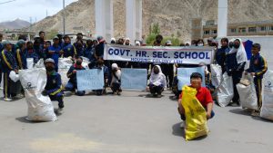 students and Staff of GHSS Housing Colony Lead Cleanliness Drive Under 'Project Clean Leh Mission'.