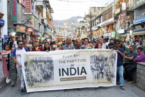 LAAC&L Leh Observes Partition Horrors Remembrance Day with Candle March, Photo Exhibition and Theatrical Performance.